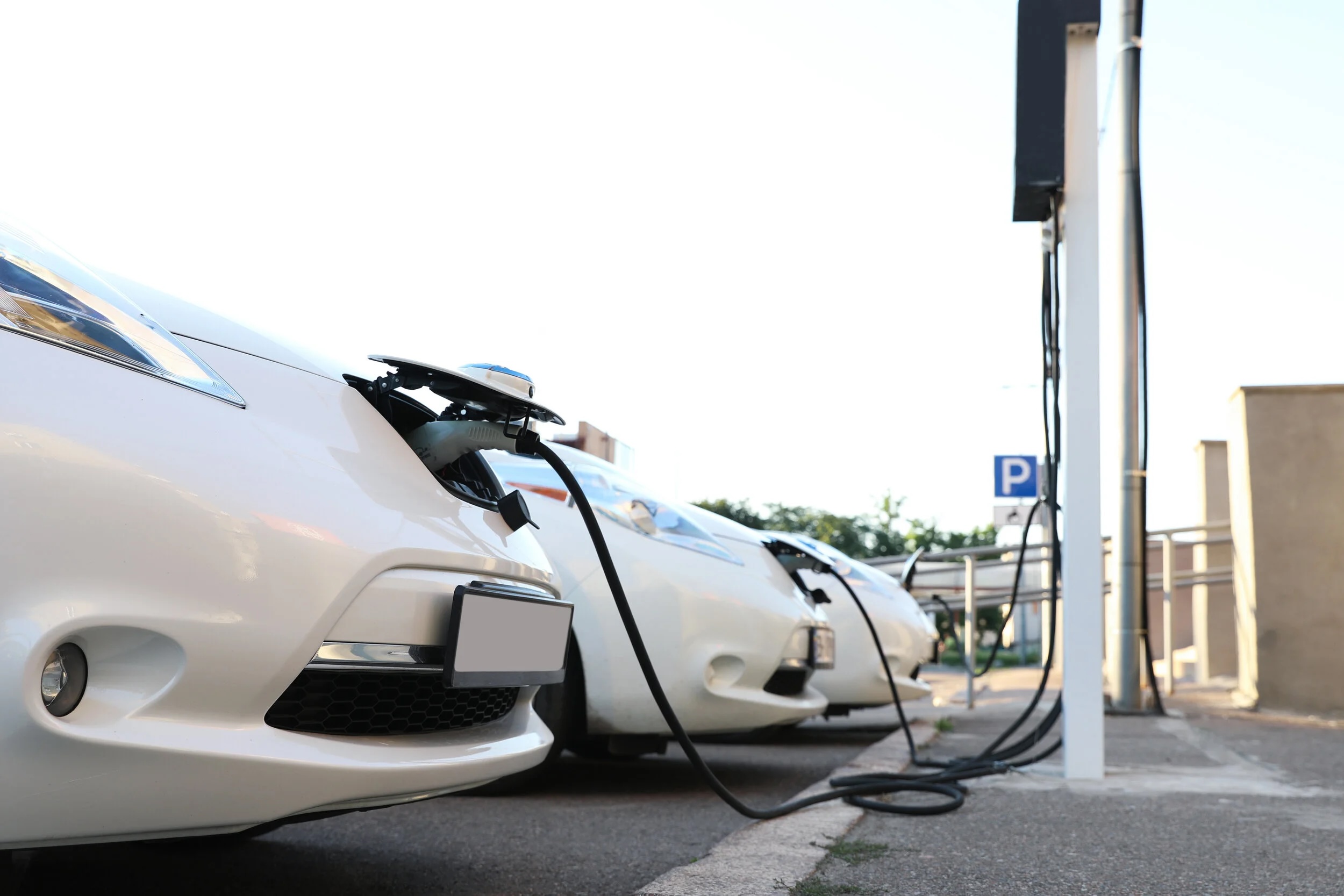 electric cars at charging station outdoors