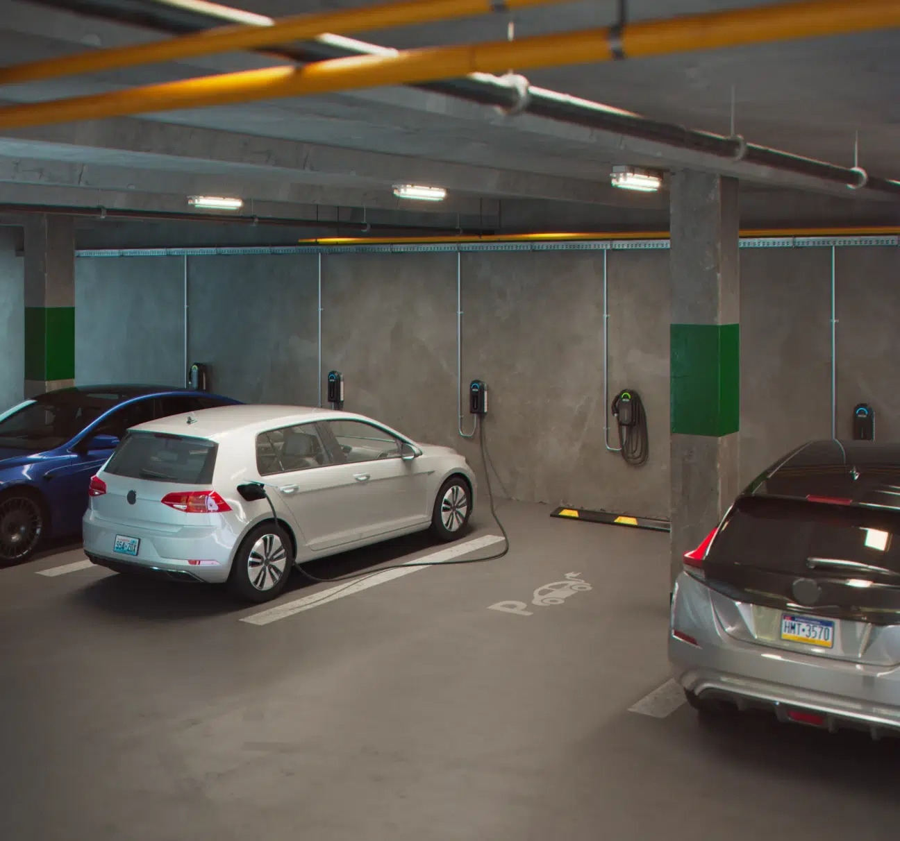 Electric vehicles charging in a residential parking garage.